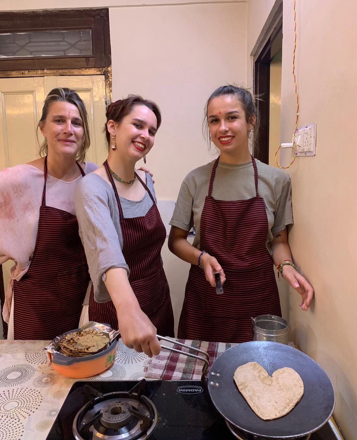 Guests cooking together at the stove