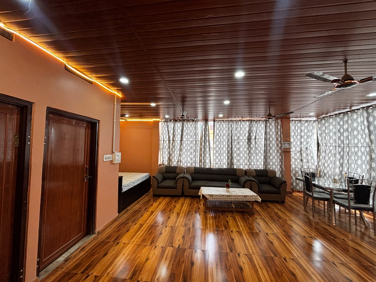 Homestay bedroom with double bed and sofa