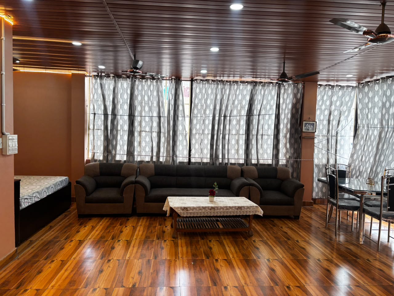 Homestay living room with sofas and dining table